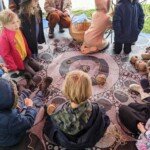 Children make string mobiles at Bu-Ka Lo-Wurru.
