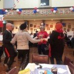 Revellers enjoy a Can Can at the 2022 Quatorze Julliet celebration.