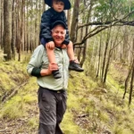 Committee member, Tim Bach, with grandson Alby.