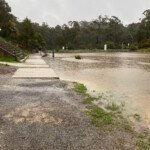 The lawn and concrete landing in front of the Lake Daylesford changerooms were flooded. (Photo: Greg Stewart)